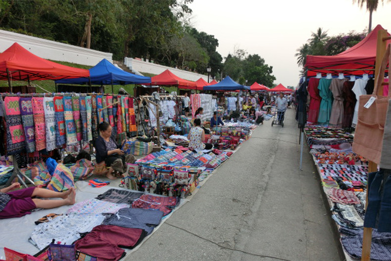 Support for trade on traditional hande-crafts goods by tribunal minorities.( Above : Lao Luang Prabaan Market )